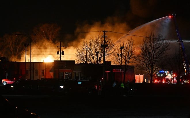 Massive industrial fire in Clinton Township sends debris a mile away